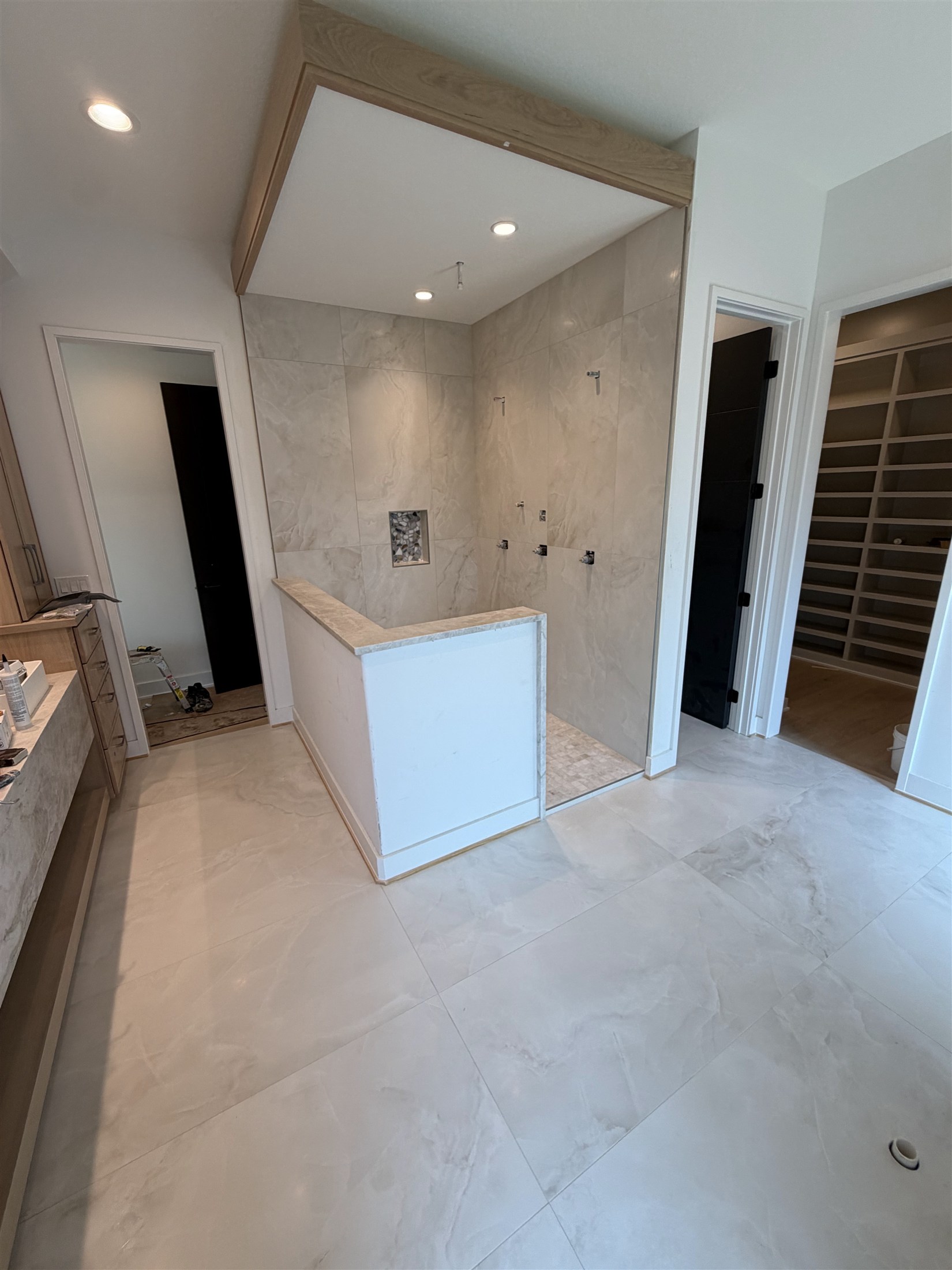 Large-format bathroom tile installed by Heartland Tile