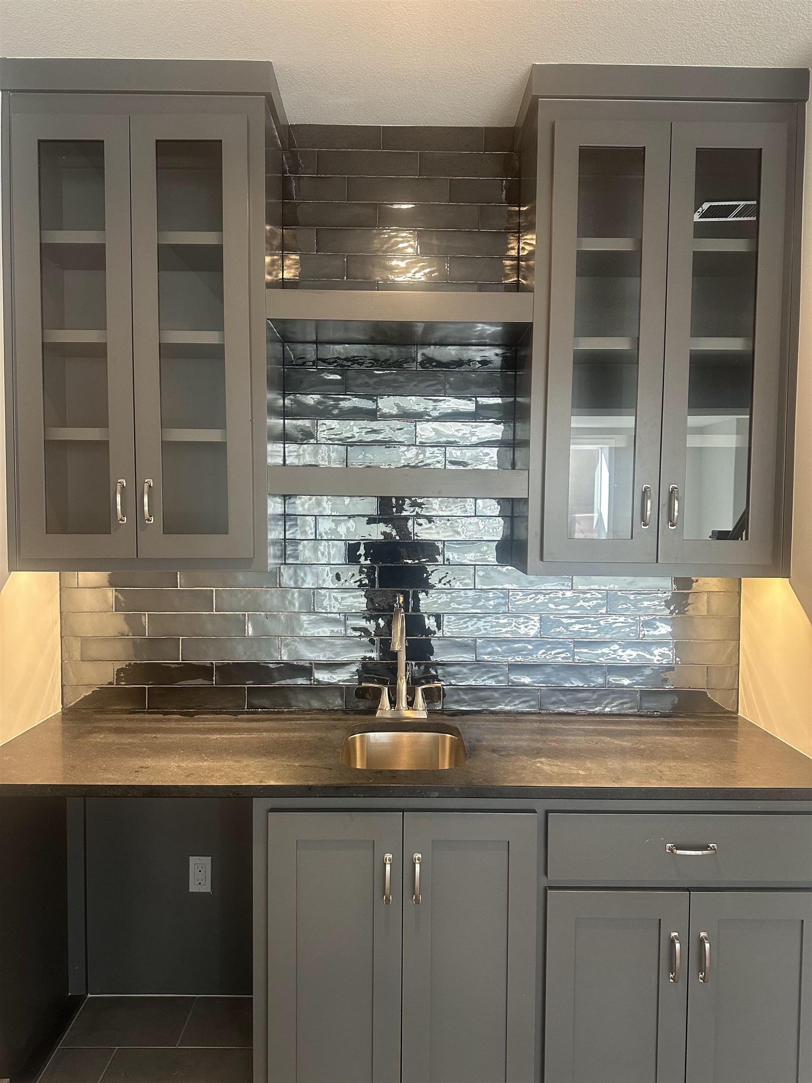 Kitchen tile & under-cabinet lighting installed by Heartland Tile