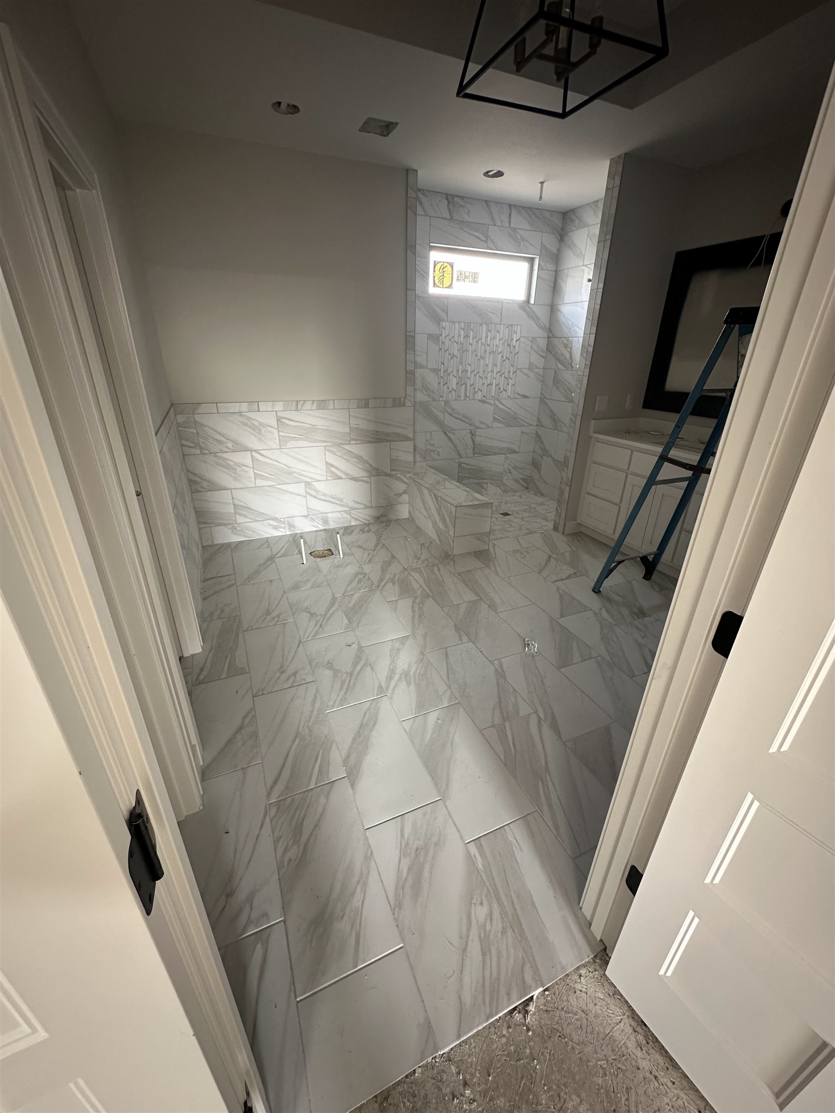Bathroom tile & shower details installed by Heartland Tile